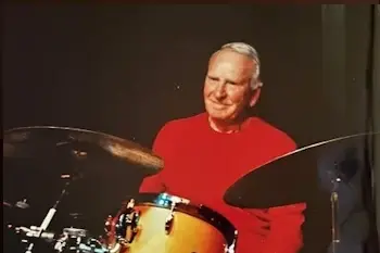Charles F. Hughes on the drums.