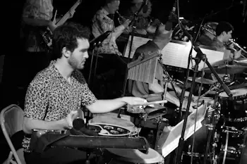 Photo of RJO percussionist playing live.